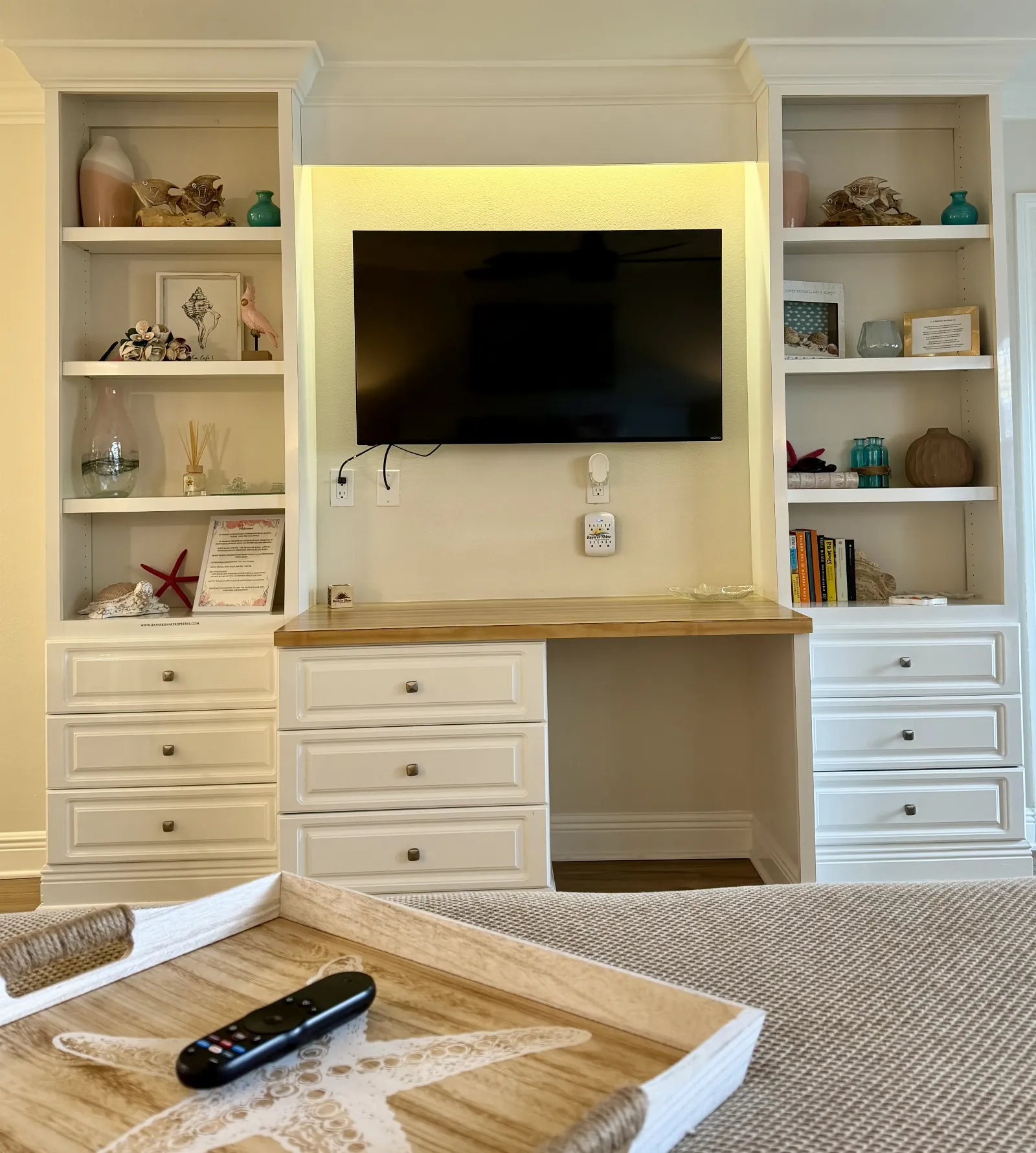 Unit 248A called "The Sands" wall unit with decor, draws and smart TV mounted on wall