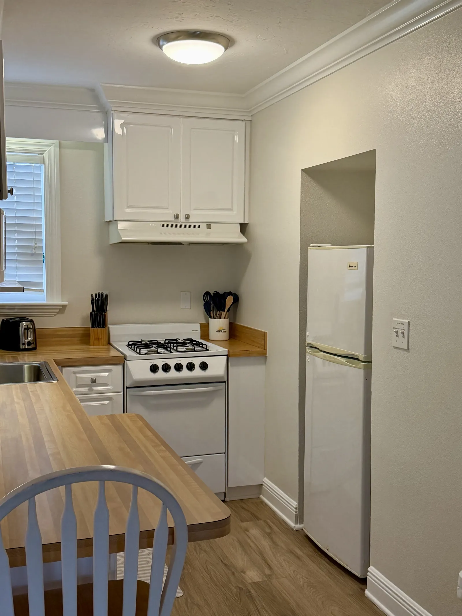 Unit 248A called "The Sands" view of kitchen stove, refrig and counter space