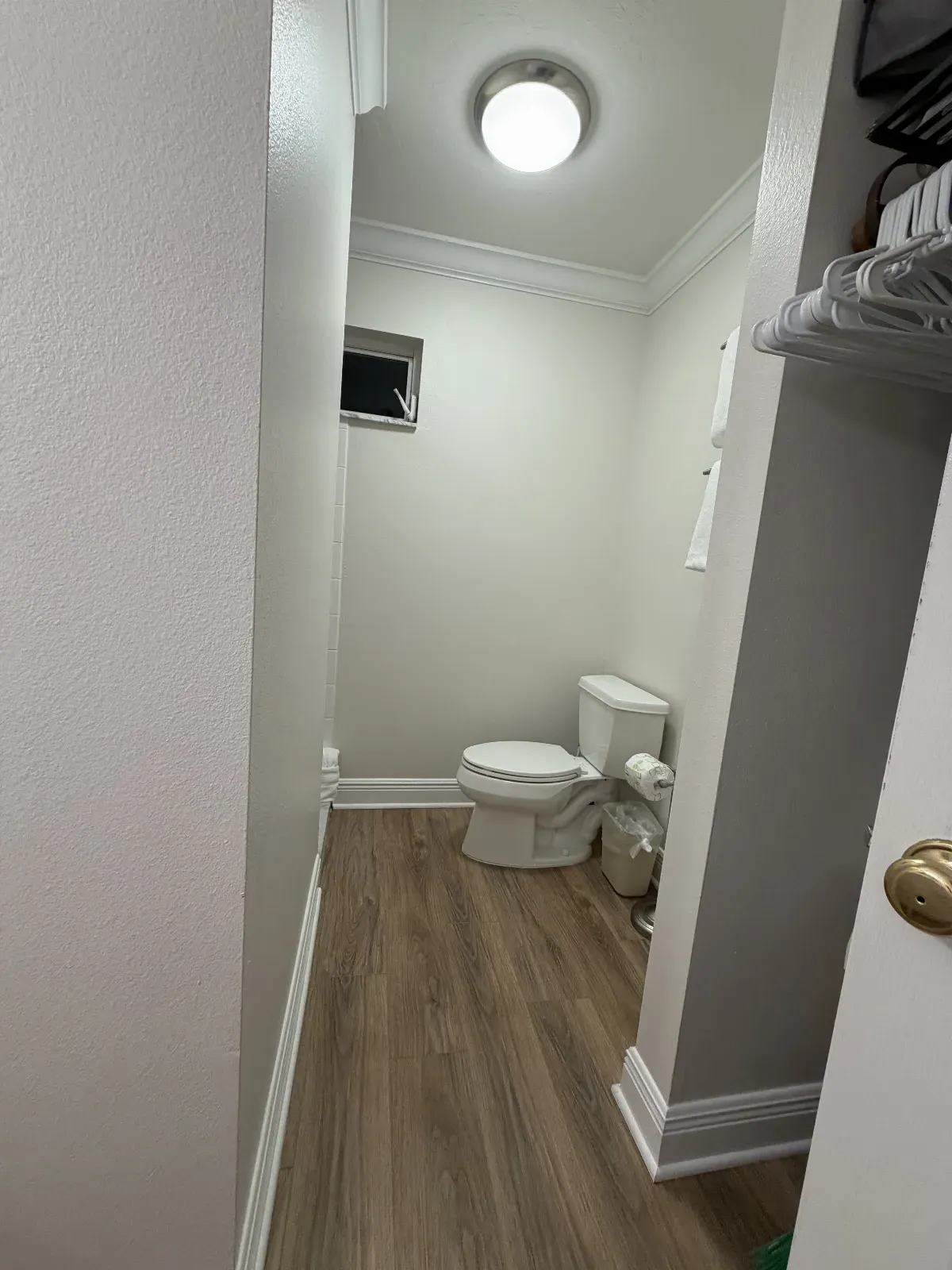 Unit 248A called "The Sands" image of toilet and wood floors